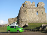 SX12380 Our green VW T5 campervan with popup roof up at Ogmore Castle.jpg